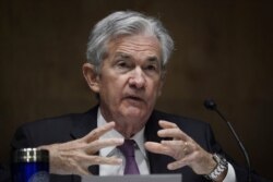 FILE - Federal Reserve Board Chairman Jerome Powell testifies during a Senate Banking Committee hearing, Sept. 24, 2020, on Capitol Hill in Washington.