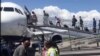 Passengers board JetBlue flight from Port-au-Prince to Fort Lauderdale, Florida, April 18, 2020. (VOA Creole/Yves Manuel)
