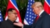 FILE - US President Donald Trump meets with North Korean leader Kim Jong Un on Sentosa Island in Singapore, on June 12, 2018. 