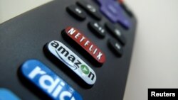 The Amazon TV button on a remote control is shown in this photo illustration, Nov. 10, 2017 