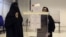 Saudi women vote during the country's municipal elections in Riyadh, Saudi Arabia, Dec. 12, 2015. Saudi women are heading to polling stations across the kingdom on Saturday, both as voters and candidates for the first time.