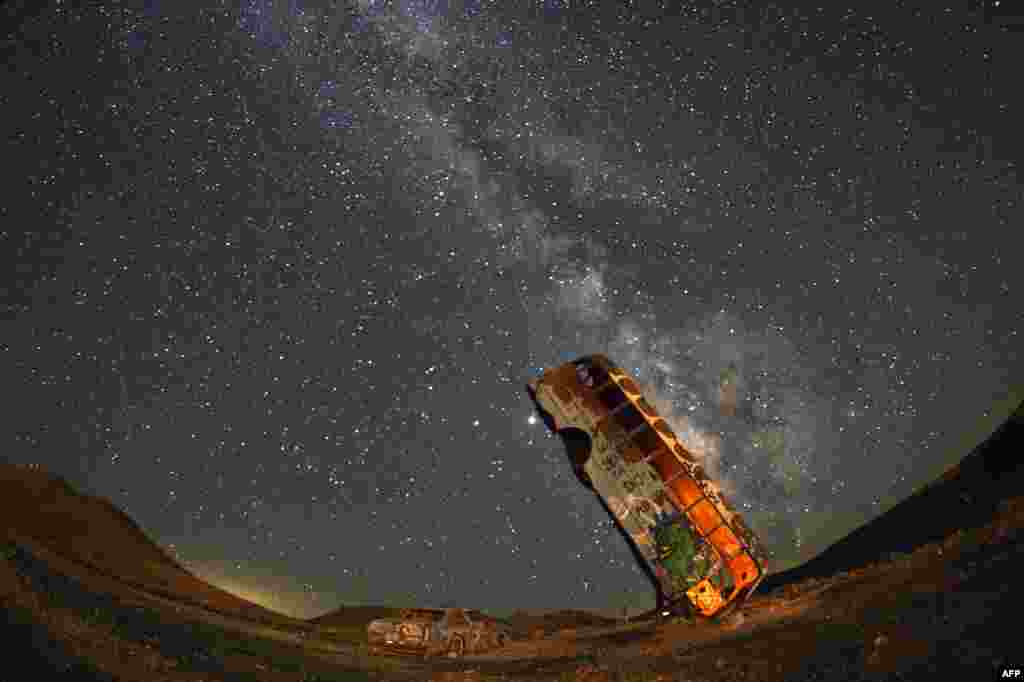 The Milky Way galaxy is seen in the sky above the International Car Forest of the Last Church in Goldfield, Nevada, July 18, 2020.