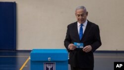 Israeli Prime Minister Benjamin prepares to vote at a voting station in Jerusalem on Sept. 17, 2019. 