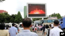 FILE - People watch a news broadcast about a missile launch in Pyongyang, North Korea, July 29, 2017. North Korean leader Kim Jong Un says the second flight test of an intercontinental ballistic missile demonstrated his country can hit the U.S. mainland.