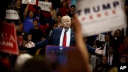 President-elect Donald Trump gestures as he speaks during a "USA Thank You" tour event, Dec. 1, 2016.