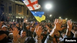 Supporters of Georgia's opposition parties hold a rally to protest and dispute the result of a recent parliamentary election won by the ruling Georgian Dream party, in Tbilisi, Georgia, on Oct. 28, 2024.