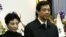 China's former Chongqing Municipality Communist Party Secretary Bo Xilai (R) and his wife Gu Kailai.