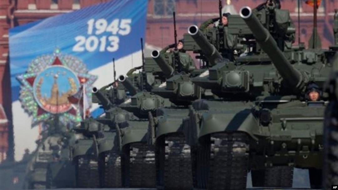 Russian tanks move along Red Square during a Victory Day parade, Moscow, May 9, 2013.