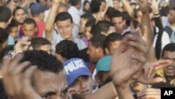 Egyptian protesters shout slogans against the military rulers during their protest at Tahrir Square, the focal point of the recent Egyptian uprising, in Cairo, Egypt, Sunday, July 24, 2011.