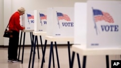 A woman votes at the Citizen Potawatomi Nation building in Rossville, Kansas, Nov. 5, 2024.