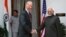 U.S. Vice President Joe Biden (L) shakes hands with Indian Vice President Hamid Ansari as they pose for the media before a meeting in New Delhi, India, July 23, 2013.