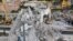 Firefighters remove rubble of the collapsed Morandi highway bridge, in Genoa, Italy, Aug. 18, 2018. 