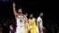 Brooklyn Nets' Spencer Dinwiddie (26) lobbies for a call to go in his team's favor during the second half of an NBA basketball game against the Los Angeles Lakers, March 10, 2020, in Los Angeles. 