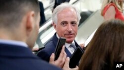 FILE - Sen. Bob Corker, R-Tenn., listens to a reporter's question on Capitol Hill, Oct. 3, 2018 in Washington. 