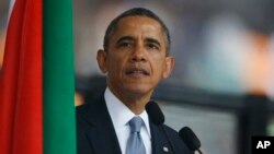 President Barack Obama speaks at the memorial service for former South African president Nelson Mandela at the FNB Stadium in Soweto near Johannesburg, Dec. 10, 2013.