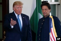 FILE - President Donald Trump gestures as he greets Pakistan's Prime Minister Imran Khan as he arrives at the White House, in Washington, July 22, 2019.
