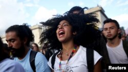 A demonstrator takes part in a protest as a national strike continues in Bogota, Colombia, Dec. 4, 2019. 