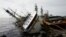 A partially capsized fishing ship is seen after Typhoon Meranti made landfall, in Kaohsiung, Taiwan, September 15, 2016. 