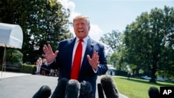 President Donald Trump talks to reporters on the South Lawn of the White House before departing for his Bedminster, N.J. golf club, July 5, 2019, in Washington. 