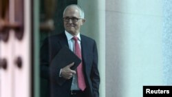 Australian Prime Minister Malcolm Turnbull arrives for a party room meeting at Parliament House in Canberra, Australia, Aug. 21, 2018. 