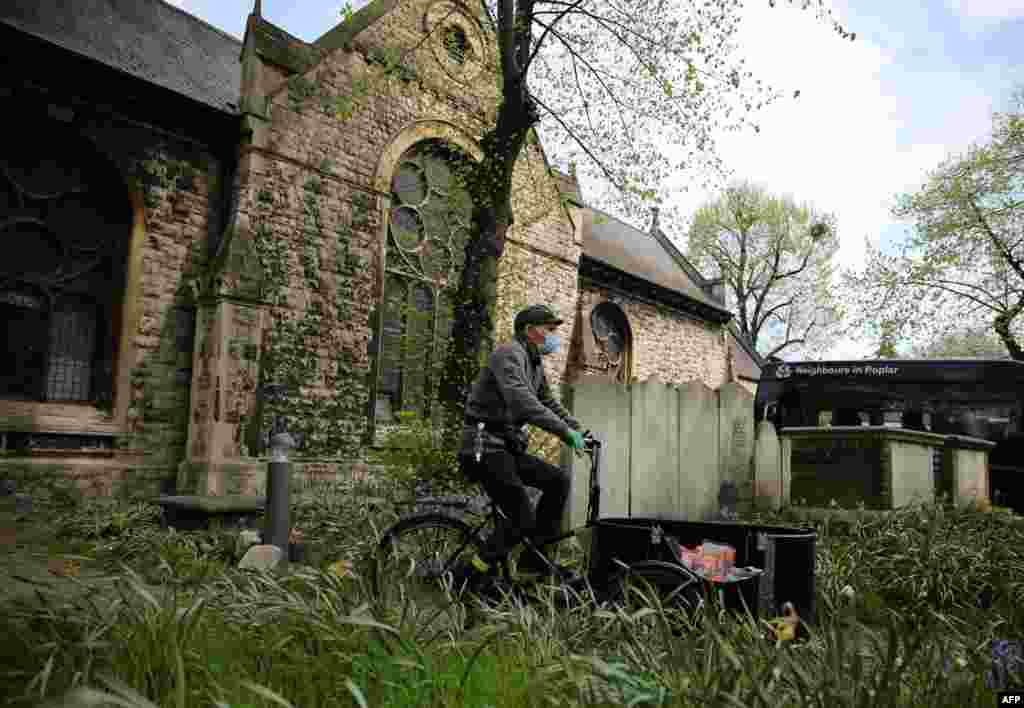 Bikeworks cycle instructor Nick Barrett sets off to deliver hot meals, as part of the Bikeworks Cycle Delivery Service (COVID-19), that have been prepared for distribution to vulnerable people, at St. Matthias Community Centre, east London.