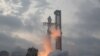 FILE PHOTO: SpaceX's next-generation Starship spacecraft atop its powerful Super Heavy rocket is launched