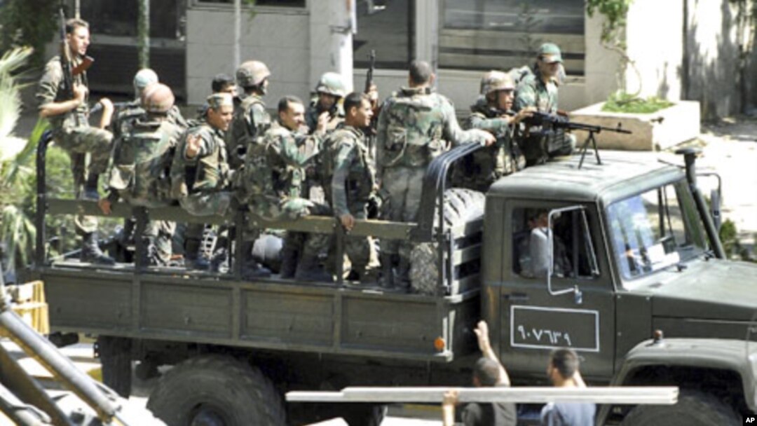 Syrian troops, in this citizen journalism image, August 14, 2011