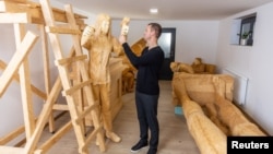 Tomislav Horvat, 34, inspects a new sculpture of Michelangelo made of matches in Domasinec, Croatia, January 17, 2024. For the last six years, Horvat has been working on the sculpture of Michelangelo and David which will be made of around 430,000 matches. (REUTERS/Antonio Bronic)