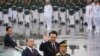 Presiden Korea Selatan Yoon Suk Yeol melambaikan tangan ke arah pengunjung dalam parade untuk memperingati Hari Angkatan Bersenjata Korea Selatan ke-75 di Seongnam, Seoul, Korea Selatan, Selasa, 26 September 2023. (Foto: Kim Hong-ji/Pool via AP)