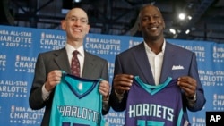 FILE - NBA Commissioner Adam Silver, left, and Charlotte Hornets owner Michael Jordan pose during a news conference to announce Charlotte, N.C., as the site of the 2017 NBA All-Star basketball game, June 23, 2015. The NBA now says it will move the game.