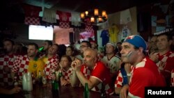 Croatian fans react to being behind late in the opening soccer match of the 2014 World Cup in the Astoria neighborhood of Queens, New York, June 12, 2014.