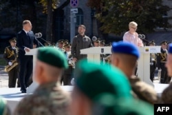 This photograph taken by Ukrainian Presidential Press Service on Aug. 24, 2024, shows, left to right, Polish President Andrzej Duda, Ukrainian President Volodymyr Zelenskyy and Lithuanian Prime Minister Ingrida Simonyte giving speeches to mark Ukraine's Independence Day, in Kyiv.