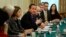 Britain's Prime Minister David Cameron (C) sits with Secretary of State for Culture Media and Sport, Maria Miller (3rd L) as he hosts an Internet safety summit at Number 10 Downing Street in London, Nov.18, 2013. 