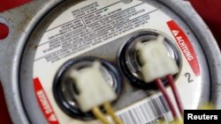 A recalled Takata airbag inflator is shown after it was removed at the AutoNation Honda dealership service department in Miami, Florida, United States, June 25, 2015. 