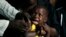 A boy reacts as he receives a yellow fever vaccine injection in the Kisenso district of Kinshasa, Congo, July 21, 2016.