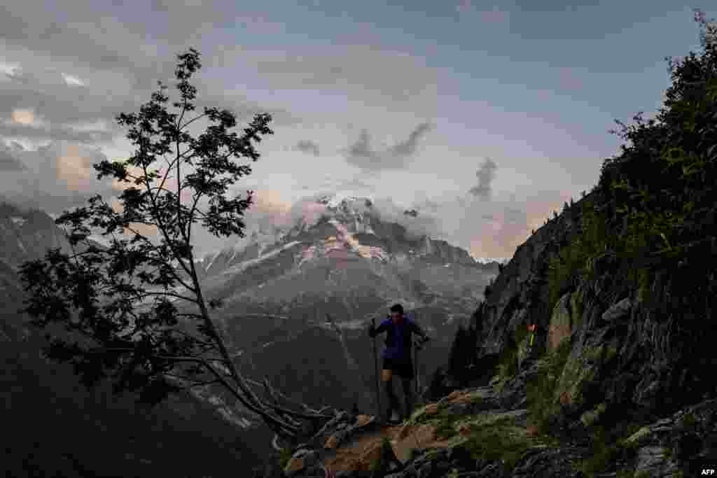 A trailer competes in the 170 km Mount Blanc Ultra Trail (UTMB) race around the Mont-Blanc crossing France, Italy and Swiss, in the Tete aux Vents near Chamonix, Aug. 31, 2019.