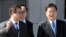 South Korea's national security director Chung Eui-yong, right, and National Intelligence Service Chief Suh Hoon, left, talk before boarding an aircraft as they leave for Pyongyang at a military airport in Seongnam, south of Seoul, March 5, 2018. 
