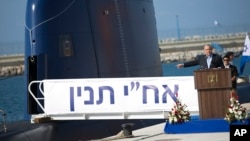 FILE - Israeli Prime Minister Benjamin Netanyahu speaks during a ceremony following the arrival of a German-built INS Tanin, a Dolphin AIP class submarine, at a naval base in Haifa, Israel, Sept. 23, 2014.