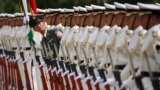 Japanese honor guard members prepare for inspection bythe Indian Defense Minister Arun Jaitley at the Defense Ministry in Tokyo Tuesday, Sept. 5, 2017. 