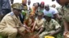 FILE - People plant trees in the Zamblara forest in Mali's Sikasso region Oct. 2, 2024, as part of a campaign with Malian NGO Energia, a partner of the Great Green Wall initiative. 