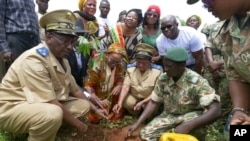 FILE - People plant trees in the Zamblara forest in Mali's Sikasso region Oct. 2, 2024, as part of a campaign with Malian NGO Energia, a partner of the Great Green Wall initiative. 