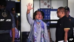 Former Philippines Senator Leila de Lima waves after she is released from the police custodial center at Camp Crame in Quezon City, Philippines on Nov. 13, 2023.