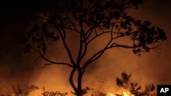 A fire burns in the Chapada dos Veadeiros National Park in Goias state, Brazil, Oct. 28, 2017. 