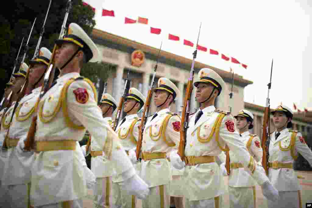 Members of a Chinese honor guard line up in formation before a welcome ceremony for Uzbek President Shavkat Mirziyoyev at the Great Hall of the People in Beijing.