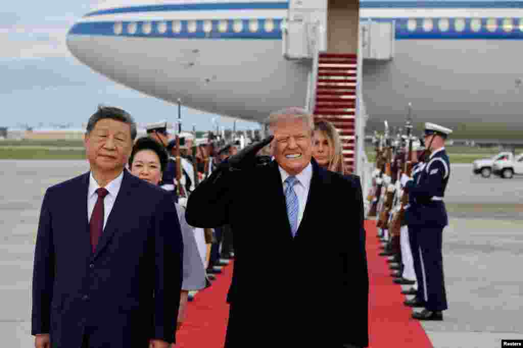 FILE PHOTO: FILE PHOTO: US President Donald Trump welcomes China's President Xi Jinping at Joint Base Andrews