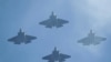 FILE - U.S. Navy F-35 jets fly over Levi's Stadium in Santa Clara, California, Jan. 11, 2020. 