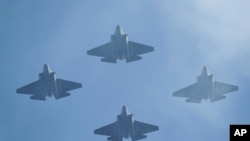 FILE - U.S. Navy F-35 jets fly over Levi's Stadium in Santa Clara, California, Jan. 11, 2020. 