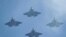 FILE - U.S. Navy F-35 jets fly over Levi's Stadium in Santa Clara, California, Jan. 11, 2020. 