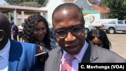 Mthuli Ncube, Zimbabwe’s new finance minister, talking to reporters after taking oath of office in Harare, Sept. 10, 2018. 