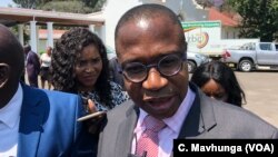 Mthuli Ncube, Zimbabwe’s new finance minister, talking to reporters after taking oath of office in Harare, Sept. 10, 2018. 